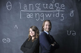 Two researchers in front of a blackboard