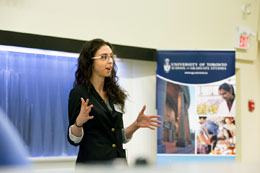 A woman presnting her thesis