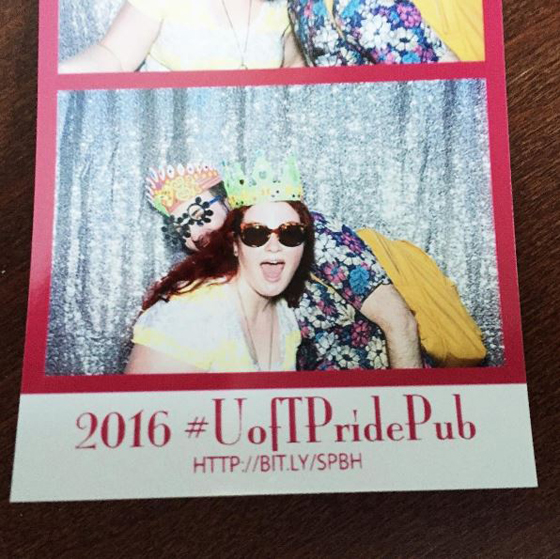 Two people who are dressed up in a photo booth at U of T Pride Pub