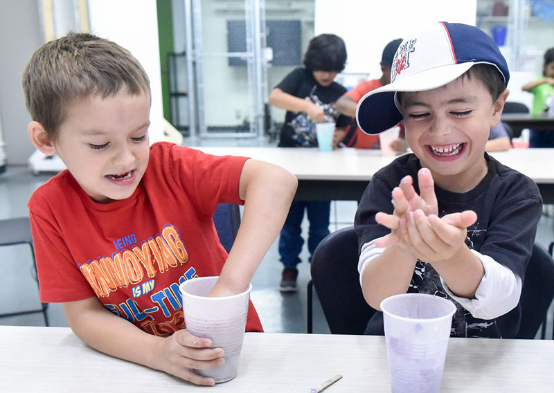 Two children make slime at Camp U of T Scarborough